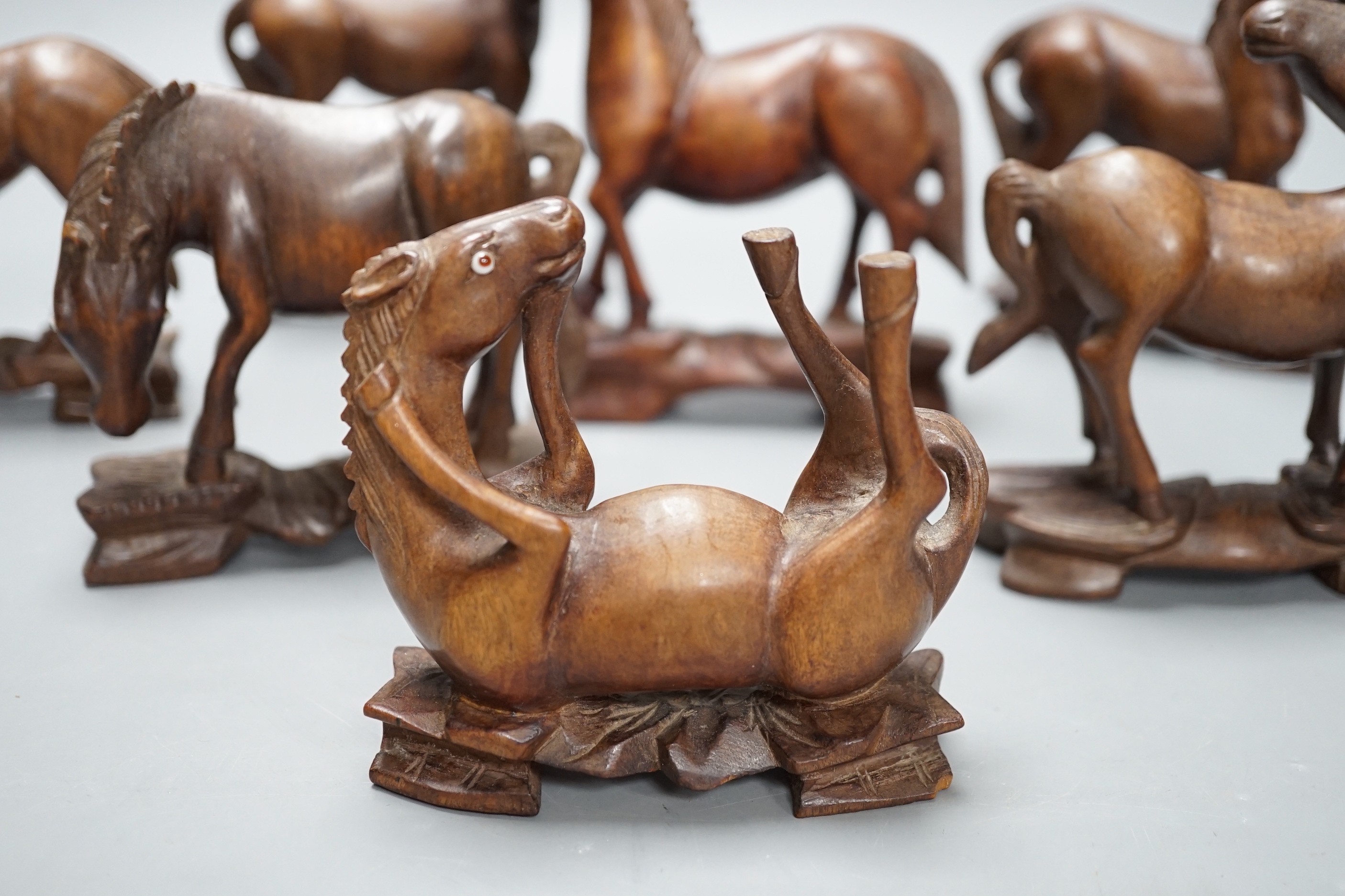 Seven Chinese hardwood models of horses. Tallest 13cm